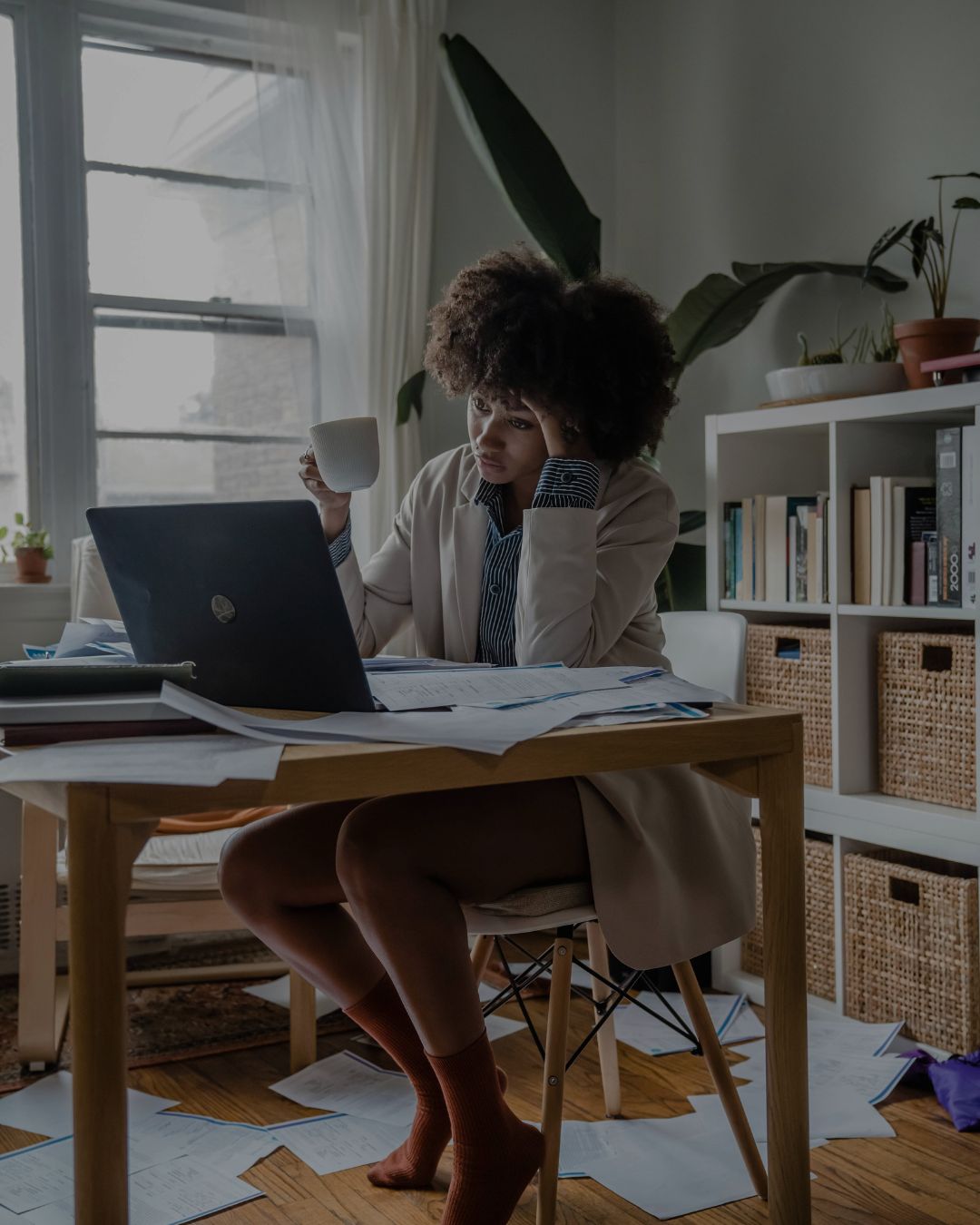 Woman at desk experiencing burnout